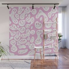 a pink and white wall mural in an apartment