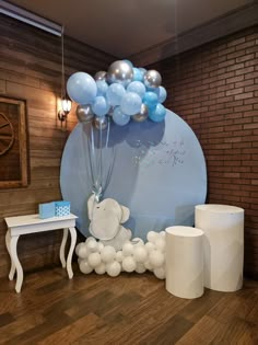 balloons are in the shape of an elephant and some other items for a baby's first birthday party