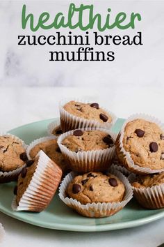 chocolate chip muffins on a plate with the words healthier zucchini bread muffins