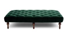 a green velvet bench with wooden legs on an isolated white background for display or montage