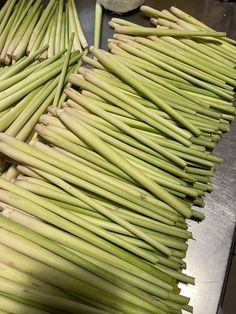 several bundles of green beans on a table