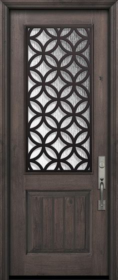 the front door is made from wood and has an iron grille design on it's side