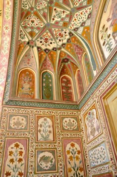 an intricately painted ceiling in the middle of a room