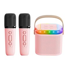 two pink microphones next to each other on a white background with a rainbow light