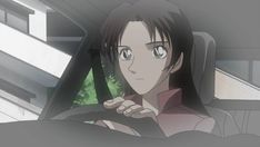 an anime character sitting in the driver's seat of a car with her hand on the steering wheel