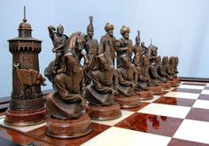 a chess board with some statues on it