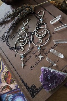 * Stunning statement Moon and Stars earrings which will give your outfit a mystical touch.  * These beautiful dangling earrings have a witchy, bohemian feel to them. * Stainless steel! * The total length of the earrings is approximately 10 cm (aprox 4 inches), hook included.  * They come in a pretty little burlap pouch 🖤 Witchy Necklace, Witchy Boho, Stars Earrings, Mystical Jewelry, Moon And Star Earrings, Witch Jewelry, Witchy Jewelry, Magical Jewelry, Celestial Jewelry