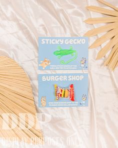 sticky gecko burger shop matches are laying on the bed next to each other