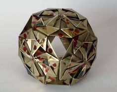 an origami ball is shown on a white surface