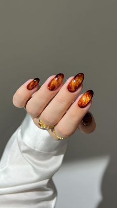 Aistė Haas on Instagram: "🍁✨ glittery amber marble for a touch of autumn elegance 🍂☕️  ✨ I used DVOK espresso marble gel and base from @sweetienailsupply ✨ for 10% off use code: AISTE   *other products used are linked on my amzn in the bio  _____ *affiliate #fallnails #glitternails #marblenails #brownnails #nails #nailinspo #nailtutorials #diynails orange amber nails aura ombre gradient, almond nails, simple classy cate velvet" Brown And Orange Ombre Nails, Red And Orange Marble Nails, Fall Fairy Nails, Orange Velvet Nails, Ember Nails, Burnt Orange Gel Nails, Glittery Fall Nails, Autumn Aura Nails, Orange Pearl Nails