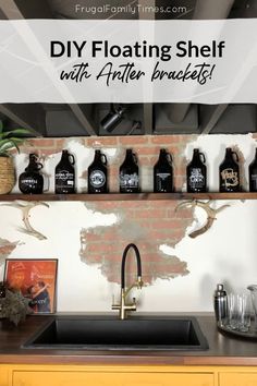 a kitchen counter with lots of bottles on it and the words diy floating shelf above it