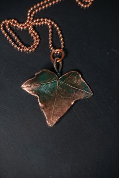 Copper jewelry pendant ivy leaf with a turquoise patina for a | Etsy Hand Cast Copper Pendant Necklaces, Hand Cast Copper Pendant Necklace, Turquoise Necklace With Patina For Gifts, Copper Flower Pendant Necklace As Gift, Handmade Bronze Leaf Jewelry, Bronze Patina Necklace For Gift, Handmade Rose Gold Nature-inspired Necklaces, Handmade Leaf-shaped Nature-inspired Jewelry, Soldered Copper Rose Gold Necklace