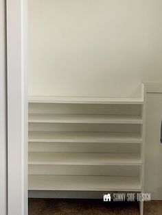 an empty shelf in the corner of a room