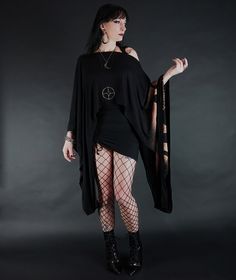 This garment features extreme contrast between the mid-waist length and the extra-long cuffed sleeves, making it an eye-catching piece. Accented with moon phases, it is exceptionally soft to the touch and has a wide boat neck that can be worn off-the-shoulder. This item is free-size, with the first set of photos demonstrating how it looks on a size small model, and the second set on a size 3X model. All my items are made to order. My turnaround time is 1-2 weeks. If you need an item by a certain time please feel free to contact me prior to purchase and I will let you know if that date is possible. First photos by S. Travis Williams, modeled by Melaney Second photos by Melaney, modeled by Courtney Worthington Kimono Sleeve Top, Witch Dress, Long Kimono, Kimono Sleeve, Fantasy Fashion, Dark Fashion, Wide Sleeves, Moon Phases