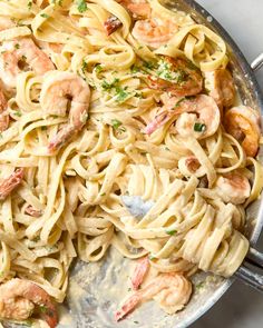 pasta with shrimp and parsley in a skillet