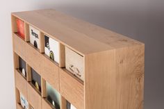 a wooden book shelf with many books on it