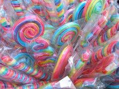 colorful lollipops are wrapped in plastic bags