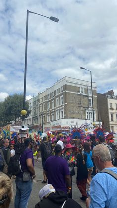 a large group of people walking down a street