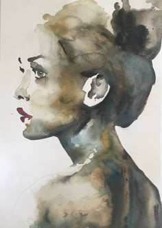 a watercolor painting of a woman's profile