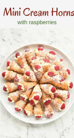 mini cream hors with raspberries on a white plate and text overlay reads mini cream hors with raspberries