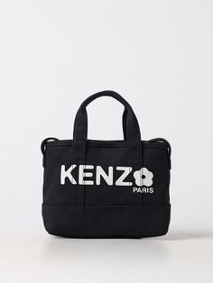 Find KENZO Handbag on Editorialist. This Kenzo handbag features a top handle and an adjustable strap. It can be worn on the shoulder or crossbody. The bag features a logo print on the front. Utility Tote Bag, Tods Bag, Men Dior, Denim Tote Bags, Black Handbag, White Handbag, Denim Tote, Raffia Bag