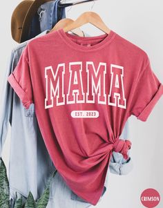 "Comfort Color Mama Est 2023 Shirt, Gift for Pregnant Wife/Sister/Friend, Pregnancy Announcement Outfit, Mommy To Be Shirt, Expecting Mama T-Shirt, Cute Mom Shirt, Mother's Day Gift for New Mom, Mom Life Shirts ✧ WHY  YOU'LL  LOVE IT ✧  ⋒ Comfort Colors® tees are garment-dyed shirts that are timeless classics and will never pile.  ⋒ Trendy retro vintage look and gorgeous colors.  ⋒ Amazingly soft and comfy. Perfect with any shorts, skirts, jeans, leggings, or nothing but undies around the house. Mom Shirt Design Ideas, Cute Mom Shirts Vinyl, Casual Red Top For Family Occasions, Relaxed Fit Tops With Lettering For Mother's Day, Red Tops With Text Print For Mother's Day, Casual Red T-shirt For Mother's Day, Casual Red Tops For Mother's Day, Red Casual Tops For Mother's Day, Short Sleeve Tops With Lettering For Mother's Day