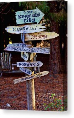 a wooden sign with many different signs on it