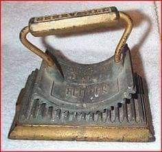 an old metal grater sitting on top of a white towel