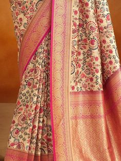 Introducing our outstanding beige kalamkari printed banarasi silk saree with blouse! Made with high-quality banarasi silk material, this saree exudes elegance and sophistication. The beige color adds a touch of grace, while the kalamkari printed work creates a mesmerizing ensemble. The rich pallu with zari weaving border enhances the overall look, making it a perfect choice for weddings, festivals, and other special occasions.
The accompanying pink color banarasi silk fabric blouse complements t Traditional Beige Saree, Unstitched Beige Bollywood Saree, Bollywood Beige Blouse With Pallu, Bollywood Style Beige Blouse With Pallu, Bollywood Style Beige Saree Blouse Piece, Cream Art Silk Saree, Cream Saree With Pallu For Navratri, Traditional Beige Saree With Zari Weaving, Beige Traditional Saree With Zari Weaving