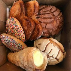 a box filled with different types of pastries