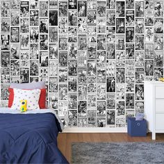 a bed room with a neatly made bed next to a wall covered in comic books