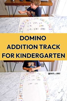 a young boy sitting at a table with domino addition track for kindergarten