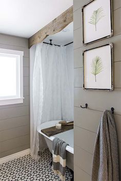 the bathroom is decorated in white and gray