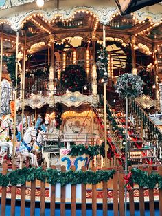 a merry go round carousel with lights and decorations