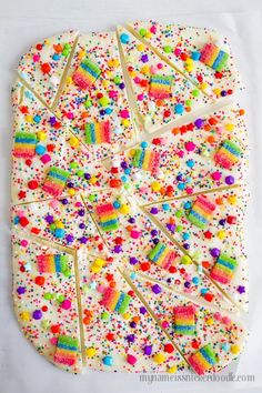 the cake is decorated with sprinkles and candy