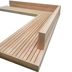 a wooden bench sitting on top of a white surface