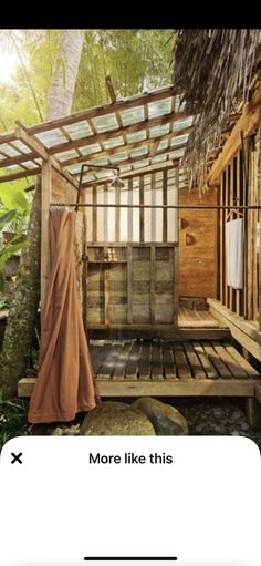 an outdoor bathroom with a shower, toilet and sink