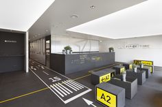 an empty lobby with yellow and black signs