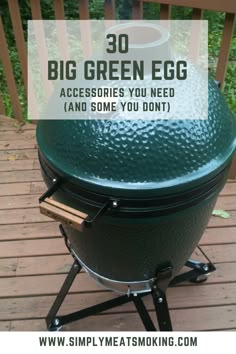 a big green egg on a wooden deck with text overlay that reads 30 big green egg accessories you need and some you don't