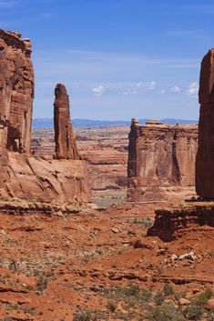 two large rocks in the middle of a desert