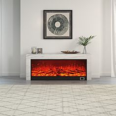 an electric fireplace in the middle of a room with a painting on the wall above it