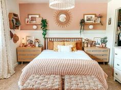 a bed room with a neatly made bed and lots of decorations on the wall above it