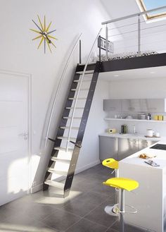 a kitchen with stairs leading up to the ceiling and counter tops, along with yellow stools