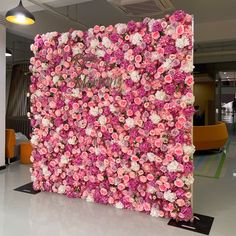 a large flower wall in an office lobby