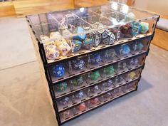 a display case filled with lots of different colored dice