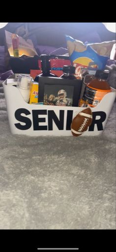 a football themed basket is sitting on the floor