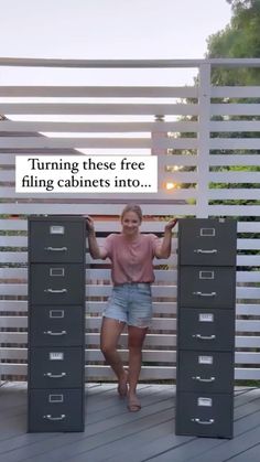 a woman standing in front of filing cabinets with a sign that says turning these free filing cabinets into