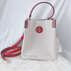 Color: Natural / Tory Red Material: Canvas And Smooth Leather Condition: Brand New With Tag Style Number: 86843 Dimension: Approx Height: 8.4" (21 Cm); Length 8.4" (21.0 Cm); Depth 4.78" (12 Cm) Adjustable, Removable Crossbody Strap With 22.5" (56.5 Cm) Drop Magnetic Snap Bridge Closure; Gusset Snaps 1 Interior Slit Pocket 100% Authentic Price Is Firm Sold Out Everywhere Rare Find Tory Burch Kira Chevron, Kira Chevron, Tory Burch Crossbody, Tory Burch Kira, Convertible Bags, Chain Crossbody Bag, Leather Bucket Bag, Leather Bucket, Tory Burch Bag