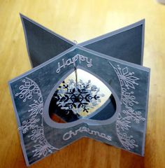 an origami christmas card with a snowflake on it and the words happy holidays