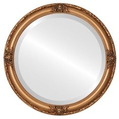 a round mirror with ornate gold frame and an oval pattern on the rim, isolated against a white background